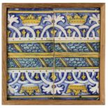 A 17th century wallplaque with four Catalan showing tiles