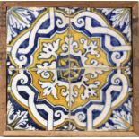 An 18th century wallplaque with four Catalan showing tiles