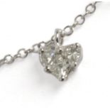 A heart shaped pendant. 18 ct. white gold with triangle cut and princess cut diamonds. With an 18 c