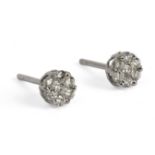 A pair of brilliant cut diamonds cluster earrings with an 18ct. white gold setting