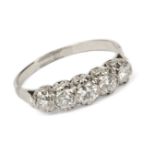 An 18 ct. white gold and brilliant cut diamonds five stones ring