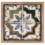 A 16th century wallplaque with four Catalan showing tiles