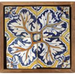 A 17th century wallplaque with four Catalan showing tiles