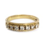 A half eternity ring. 18 ct. yellow gold and brilliant cut diamonds