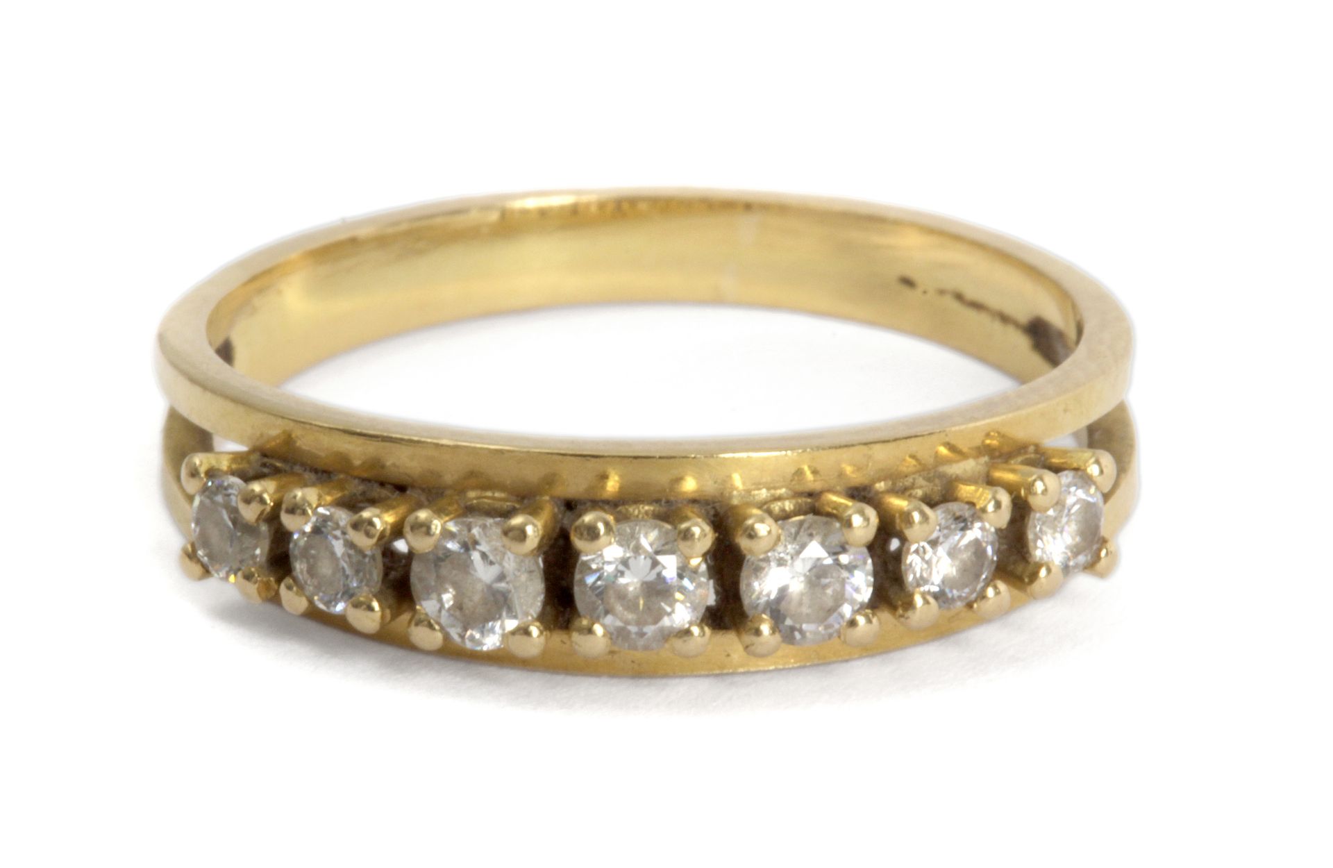 A half eternity ring. 18 ct. yellow gold and brilliant cut diamonds