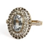 A navette shaped ring circa 1950. 18 ct. yellow gold, platinum, an oval cut synthetic spinel and ro