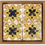 An 18th century wallplaque with four Catalan showing tiles