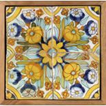 An 18th century wallplaque with four Catalan showing tiles