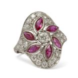 A platinum navette shaped style ring with brilliant cut diamonds and synthetic rubies