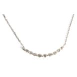 A 0,10 ct. brilliant cut diamonds half moon style pendant with an 18 ct. white gold setting and cha