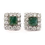 A pair of emerald cluster earrings. Platinum setting, emerald cut emeralds and 2,88 ct. of brillian