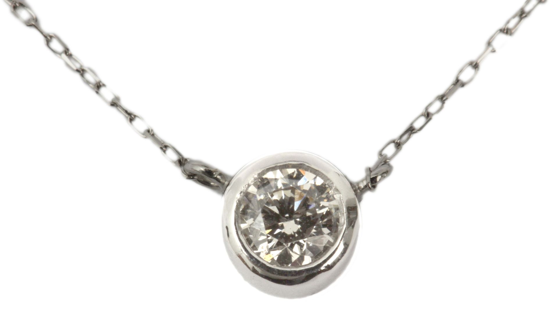 A diamond necklace. A 18 ct. brilliant cut single diamond in a 18k. white gold setting with an 18 c