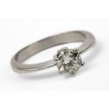 An 18 ct. white gold engagement ring with a 0,60 ct. brilliant cut diamond