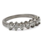 An 18 ct. white gold half eternity ring with brilliant cut diamonds