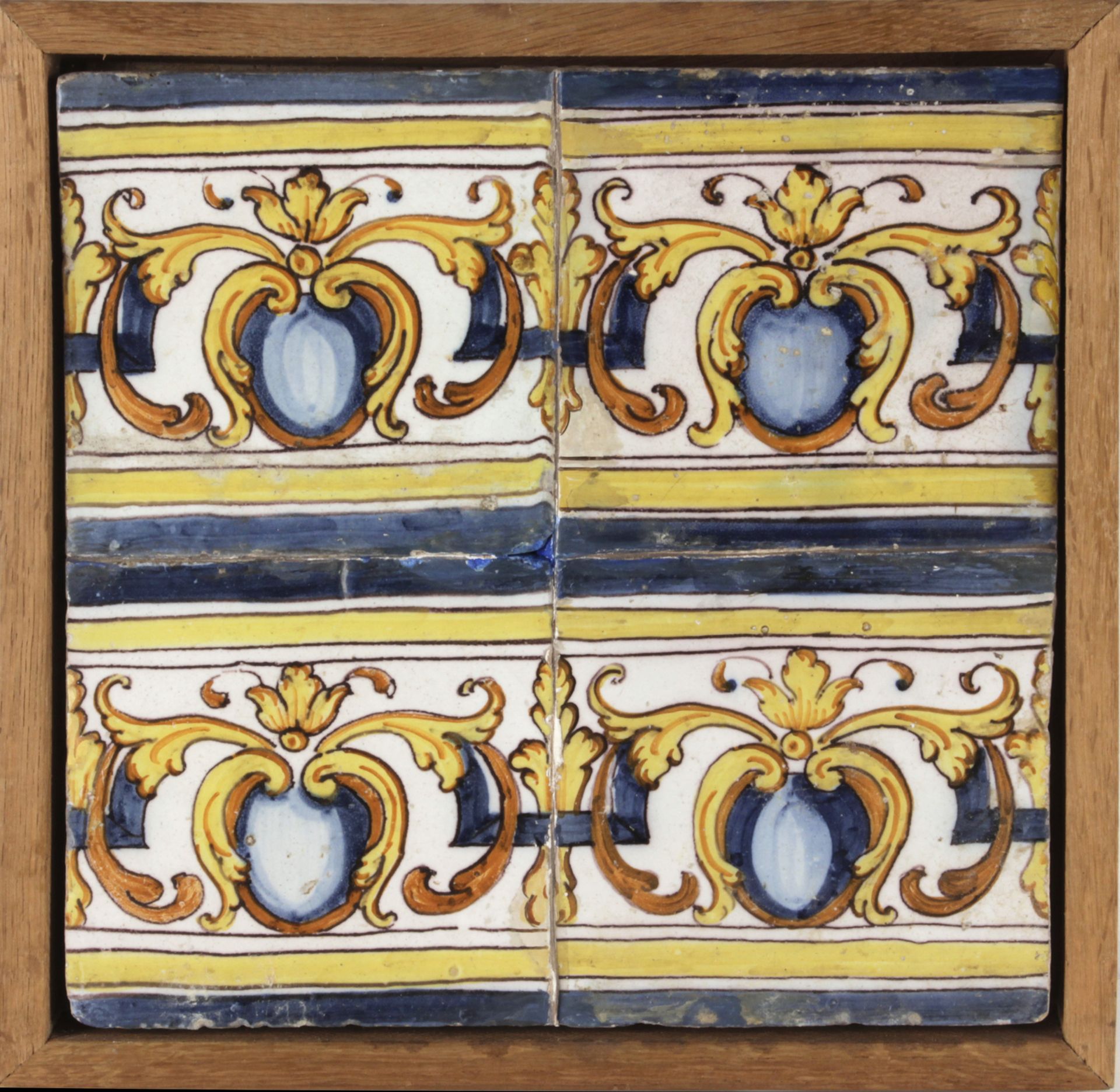 A 17th century wallplaque with four Catalan showing tiles
