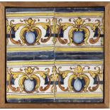 A 17th century wallplaque with four Catalan showing tiles