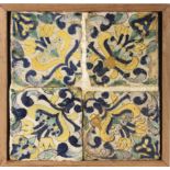 An 18th century wallplaque with four Catalan showing tiles