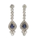 A pair of long earrings. Platinum, 1,44 ct. of brilliant cut diamonds and pear cut sapphires