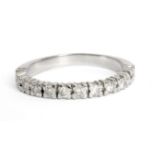 An 18 ct. white gold half eternity ring with brilliant cut diamonds