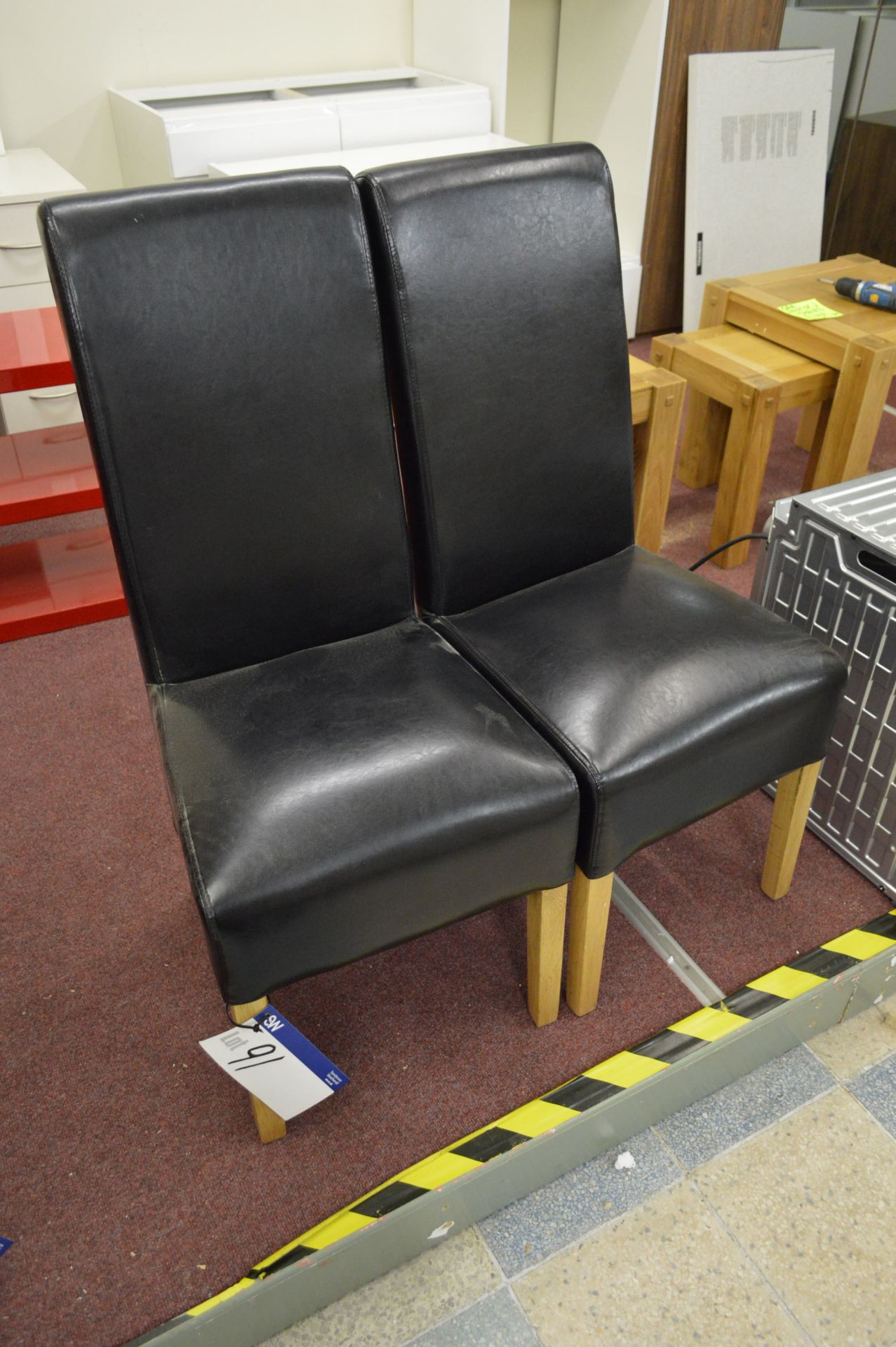 Two Black Leather Stand Chairs