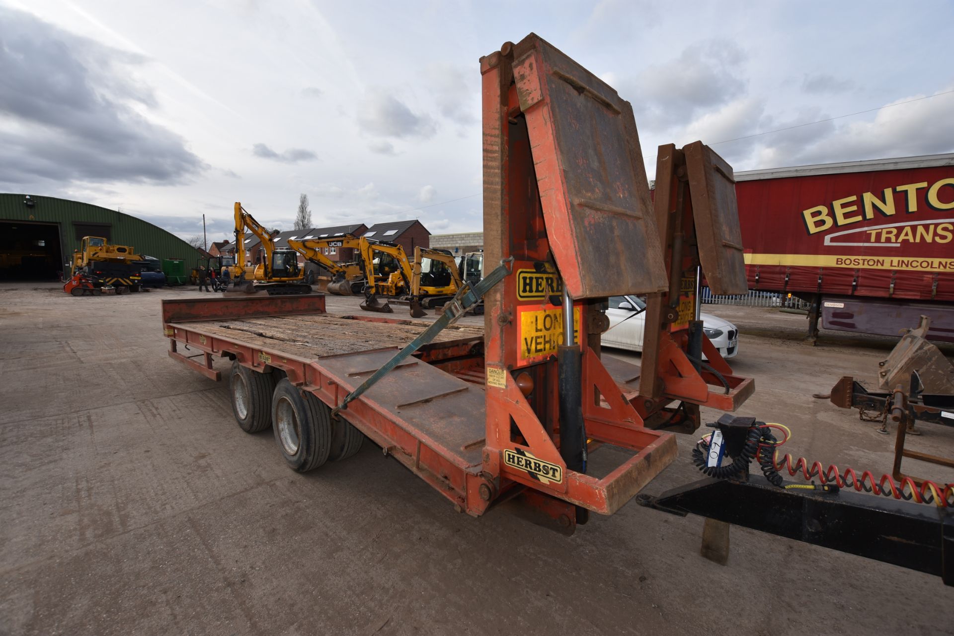 Herbst twin axle tandem wheel drawbar plant trailer with hydraulic ramps. Overall dimensions: 6.5m x