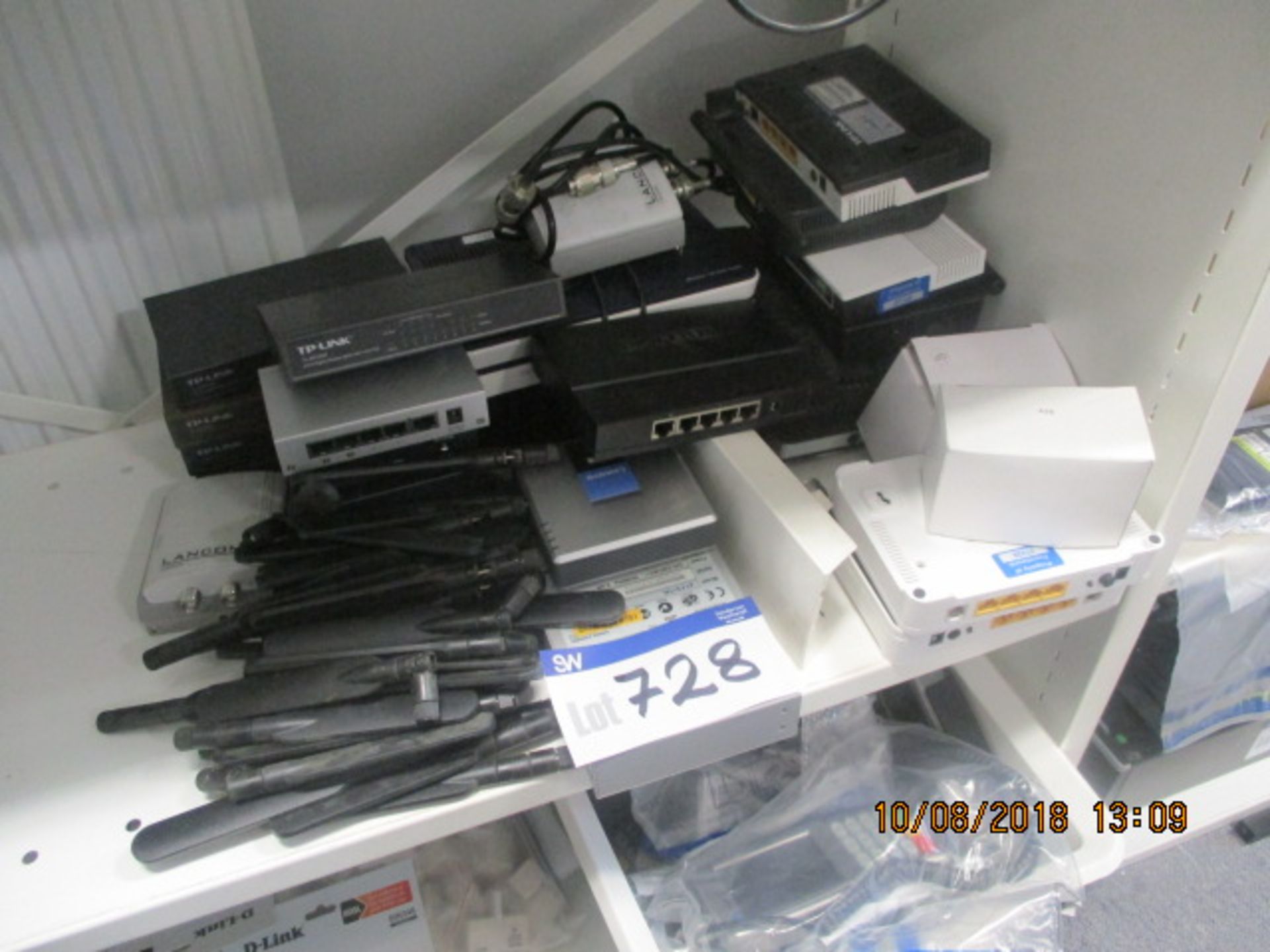 Assorted Switches and Routers, as set out on shelf