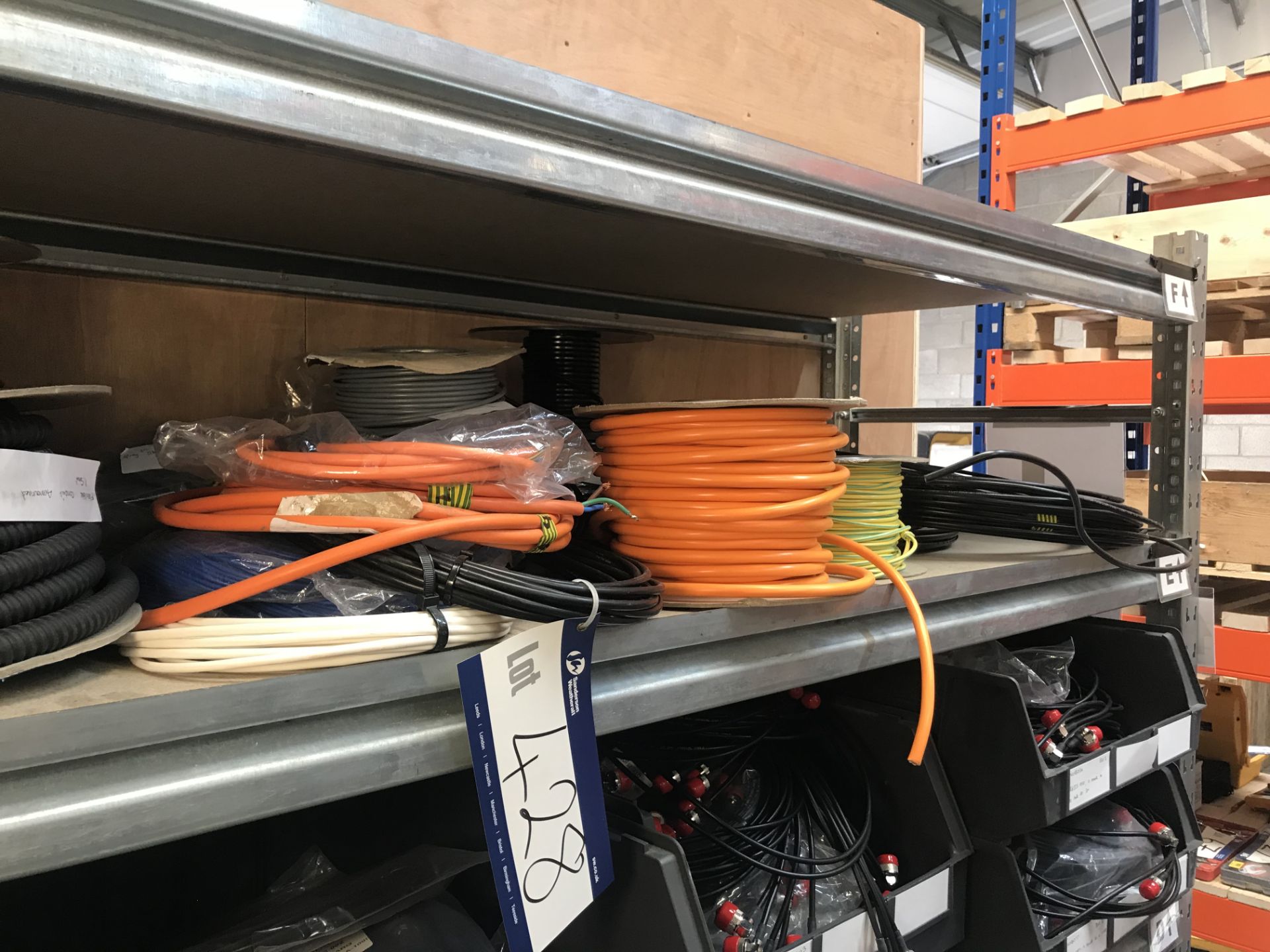 Quantity of Electrical Cable and Armoured Conduits on shelf