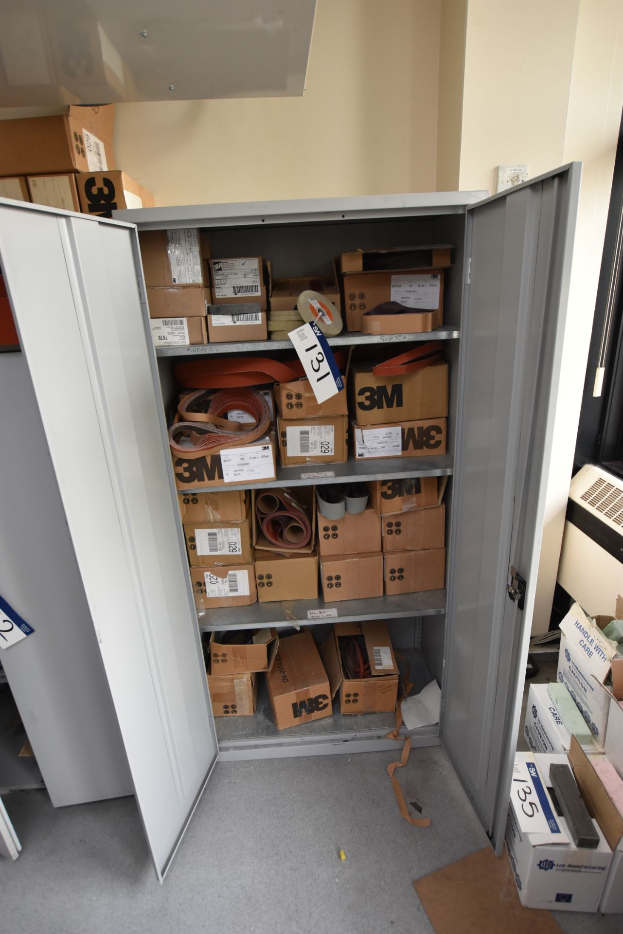 Contents of Double Door Cupboard including Linishing Belts and EXL Unitized Wheels