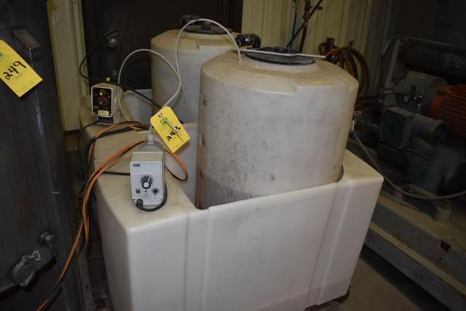 Chemical Process System Consisting of (2) RMI 60 Gal. Poly Tanks, (2) Pumps, RIGGING FEE: $50