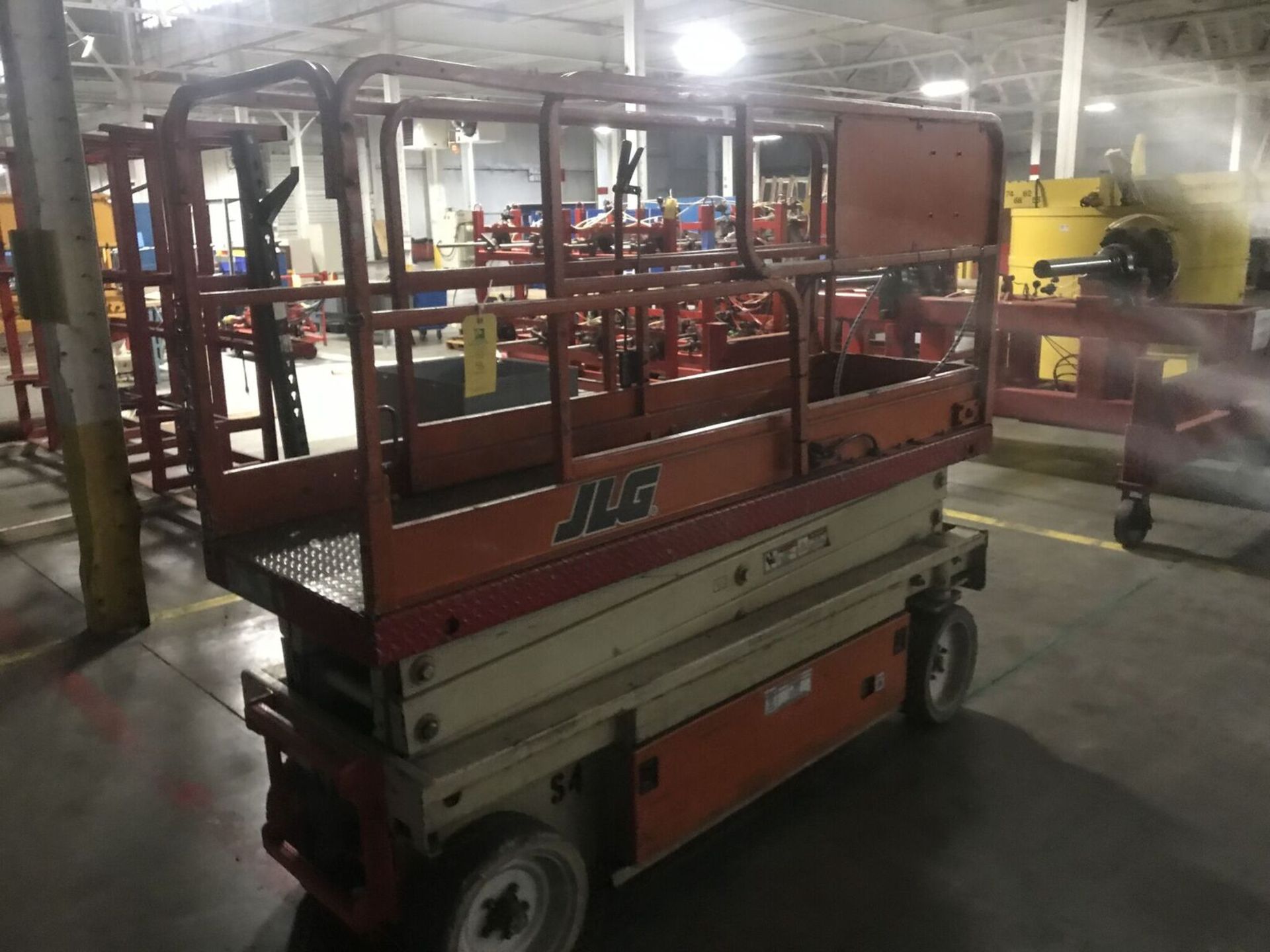 JLG Scissor Lift, Model #2033-F, Serial #0201040-49, Max Height 20ft., Rigging Fee $100