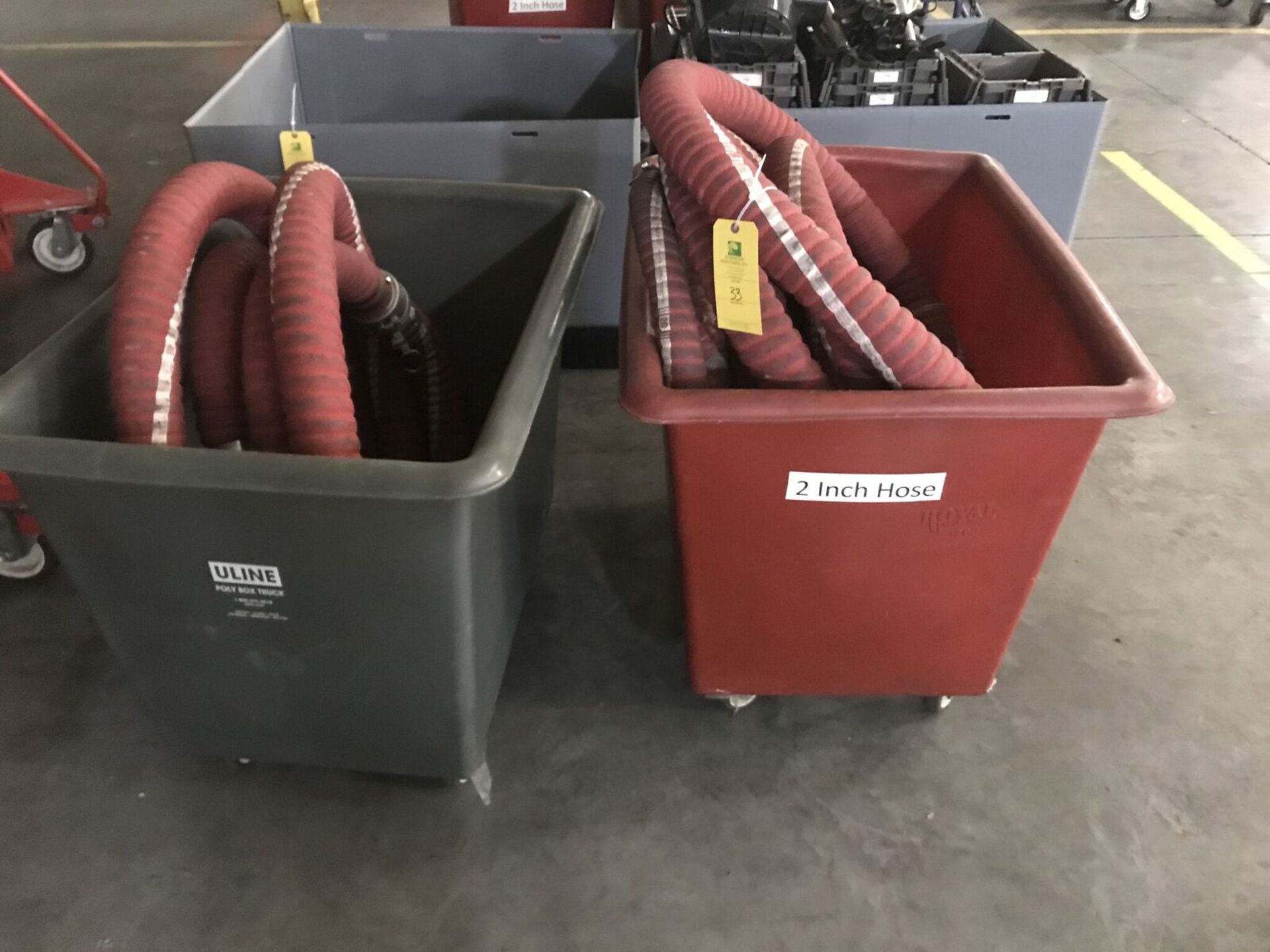 Two Containers w/ Red Hoses, Rigging Fee $20