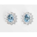 Aquamarin-Brillant-Ohrstecker 750 Weissgold. 2 oval fac. Aquamarine ca. 4.70 ct und 24 Brillanten