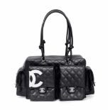 Chanel, Tasche "Cambon Reporter"Aus schwarzem, gestepptem Lammleder. Silberfarbene Metallteile. Zwei