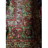 A large Red ground Axminster Wool Carpet of classical design