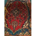 A Red ground Persian Surok village Rug