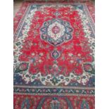 A red ground old Persian Marshad Carpet with a unique all over design. 386cm x 270cm