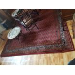 A really good Burgundy ground Rug with multi borders and allover decoration