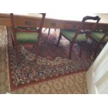 A large Rust ground Rug with all over decoration and multi borders