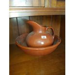 A 19th Century Terracotta glazed Wash Bowl and Jug