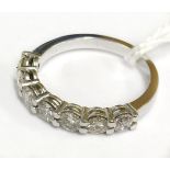 18CT WHITE GOLD AND DIAMOND HALF ETERNITY RING