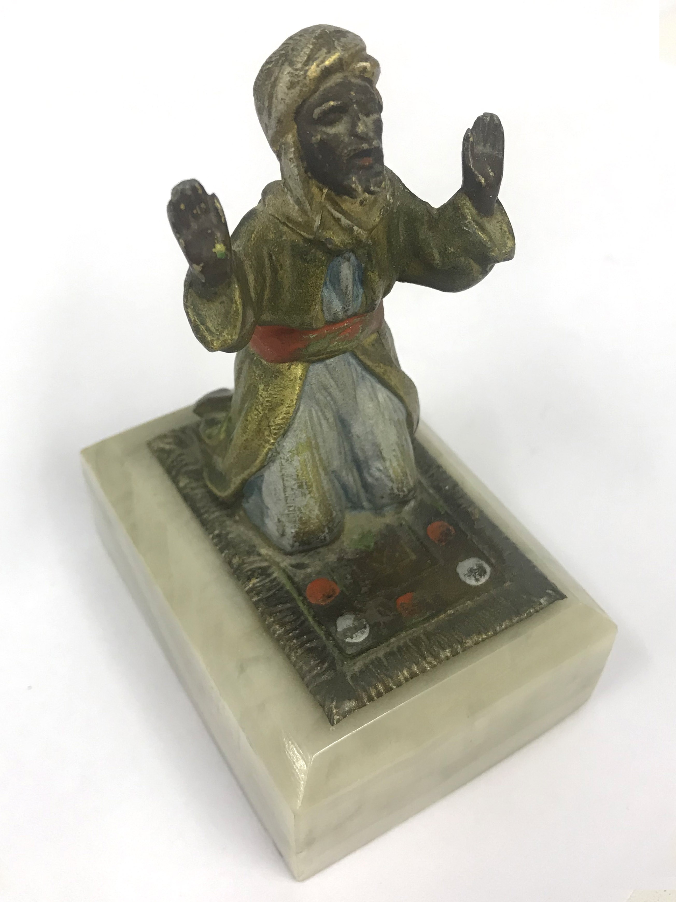 METAL FIGURINE OF PRAYING MAN ON MARBLE BASE