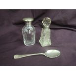 A cut glass perfume bottle having HM silver collar, another similar with plated screw top lid and