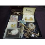 A small selection of costume jewellery including cufflinks, brooches, cased pen etc