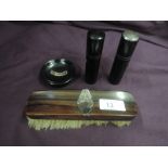 Four ebony dressing table items all having HM silver panels