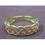 A 9ct gold band ring having Celtic style pierced decoration, size L