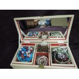 A jewellery box containing a selection of costume jewellery including bead necklaces etc