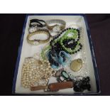 A small selection of costume jewellery including wrist watches, crystal beads, glass beads etc