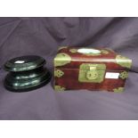 An Oriental style jewellery box having a Jade amulet inset to lid, and a trophy stand