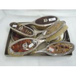 Five HM silver dressing table brushes and two hand mirrors all having tortoise shell backs with