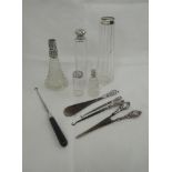 A selection of HM silver including glass dressing table pots with HM silver lids and collars,